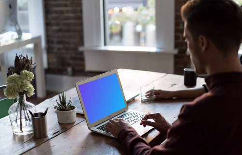 Man working on Macbook Air mockup