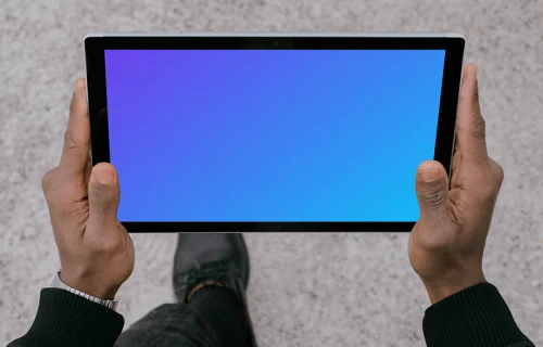 Microsoft Surface Laptop mockup held by a man