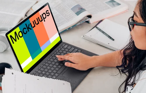 Microsoft Surface laptop mockup used by a lady in glasses