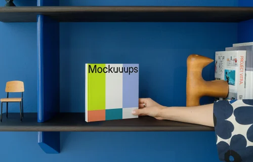Mockup of a square book on a colorful shelf