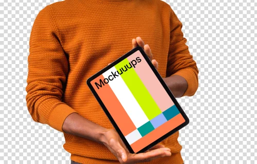Mockup of iPad held by man in orange sweater
