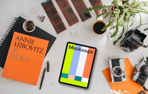 Mockup of tablet device next to the colorful books