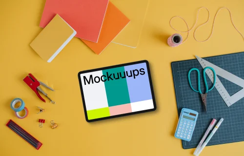 Mockup of tablet placed on the yellow background