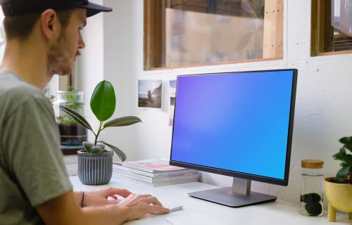 Mockup of young man working on the computer