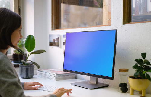 Mockup of young woman working on the computer