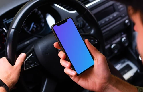 Over the shoulder view of a driver using iPhone 11 mockup