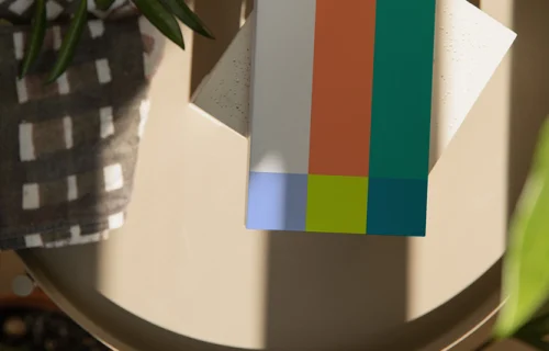 Paperback mockup on a round table with plants