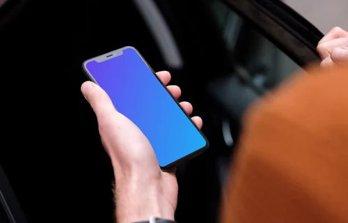 Passenger entering a car holding an iPhone 11 mockup
