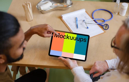 Patient with the doctor and a tablet mockup