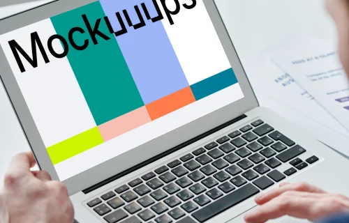 Person holding a MacBook Air mockup