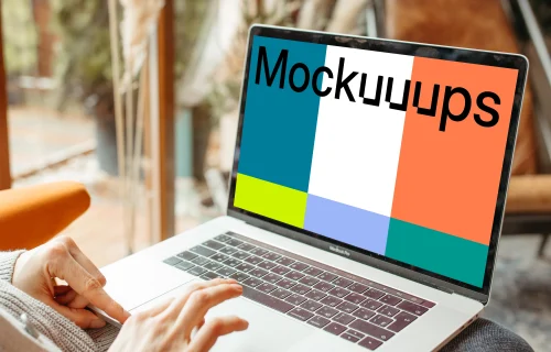 Person typing on a MacBook Pro mockup