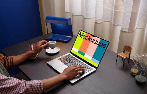 Person working on a MacBook Pro mockup