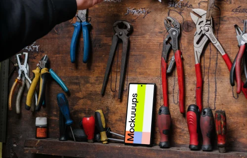 Pixel 6 mockup leaning on a tool rack