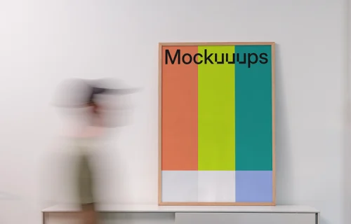 Poster mockup above a minimalist office cabinet
