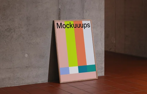 Poster mockup leaning against a concrete wall