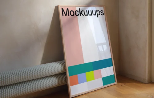 Poster mockup leaning against a textured wall