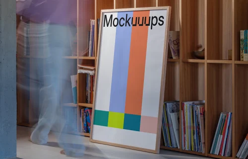 Poster mockup leaning against a wooden bookshelf