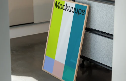 Poster mockup leaning against an office partition
