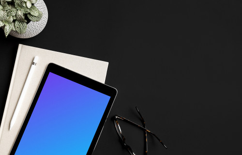 Rotated iPad Pro mockup on dark table