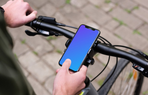 Sitting on bike tapping the iPhone 11 Pro mockup in bike mount