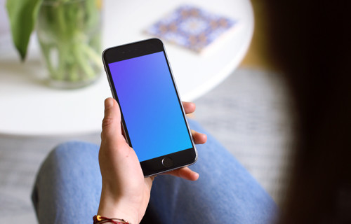 Sitting on the couch with iPhone 6s mockup