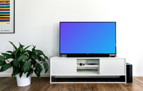 Smart television mockup beside a flower pot