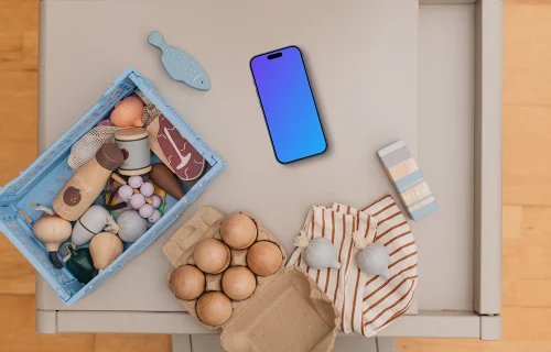 Smartphone mockup among children's toys