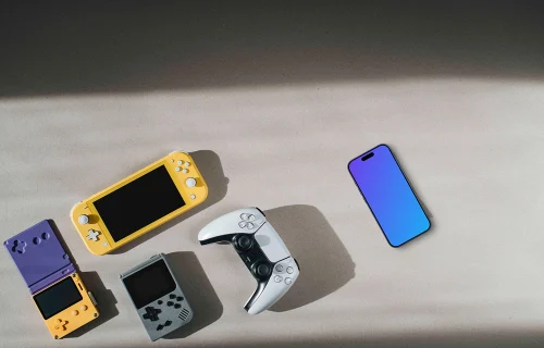 Smartphone mockup among gaming devices on neutral background