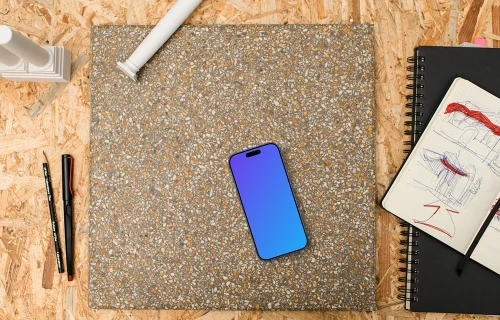 Smartphone mockup with architectural sketching supplies