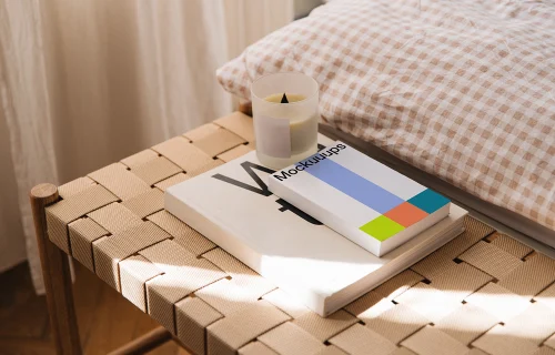 Softcover book mockup on a woven bench in natural light