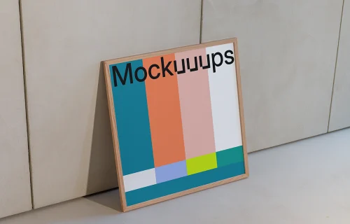 Square poster mockup leaning against a textured wall
