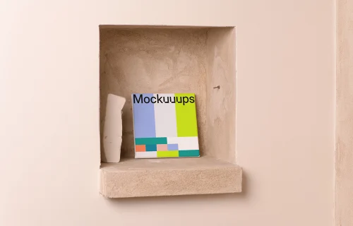 Square poster mockup on a beige recessed shelf