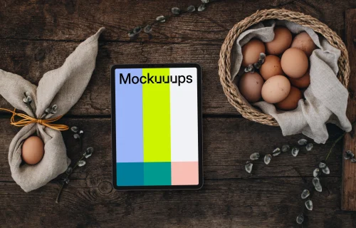 Tablet mockup among eggs for the Easter season