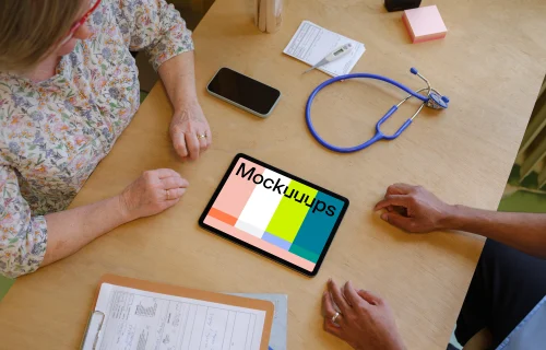 Tablet mockup between doctor and the patient