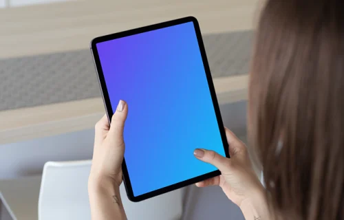 Tablet mockup held by lady in a kitchen
