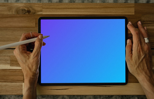 Tablet mockup in use on a neat wooden table
