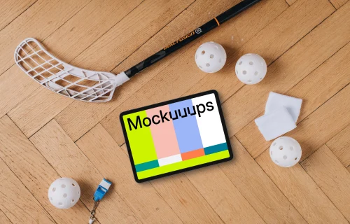 Tablet mockup next to the floorball stick