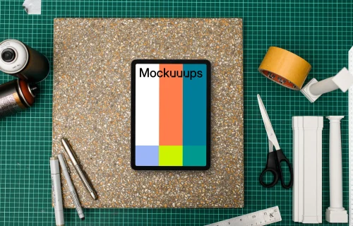 Tablet mockup on architects workspace with tools