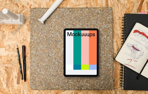 Tablet mockup surrounded by architectural drawing materials