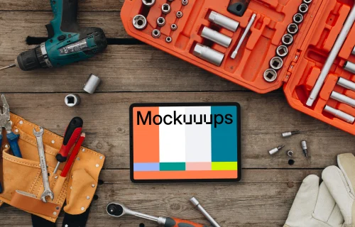 Tablet mockup surrounded by workshop tools