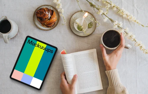 Tablet mockup with coffee and book on the table