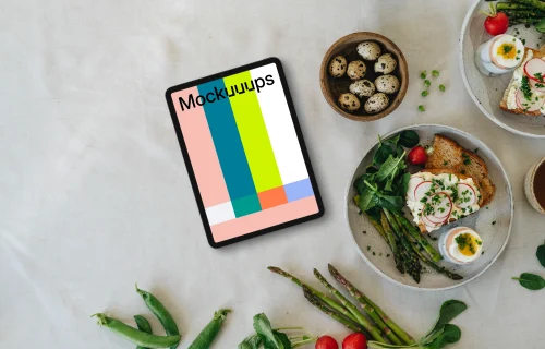 Tablet mockup with Easter snack and spring vegetables