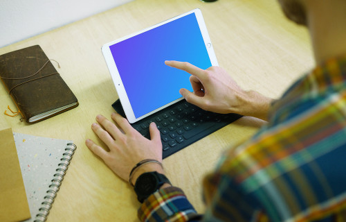 Tapping on iPad Pro mockup with keyboard