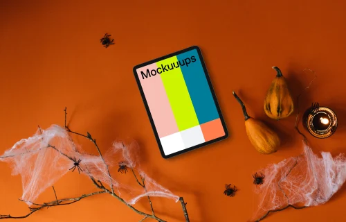 Top view of halloween presentation template with a tablet