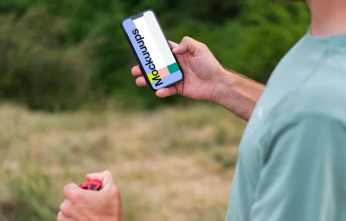 Trail runner checking a phone mockup