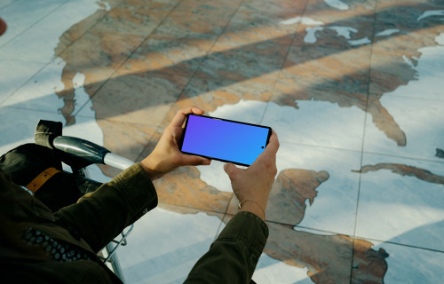 User holding a phone mockup