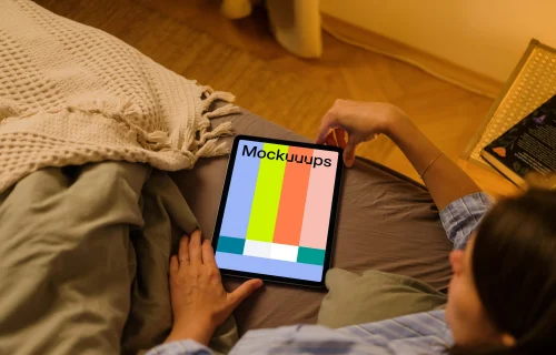 User holding an iPad Air mockup