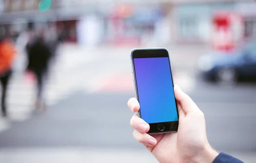Walking with iPhone 6 mockup on crosswalk