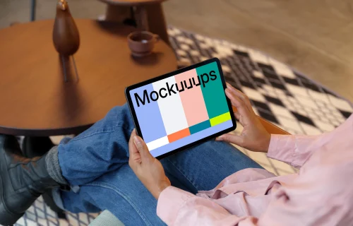 Woman holding an iPad Air mockup