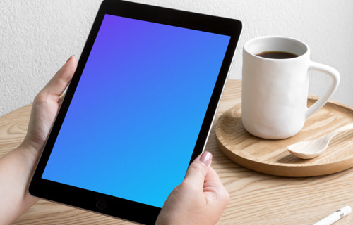 Woman holding iPad Pro mockup